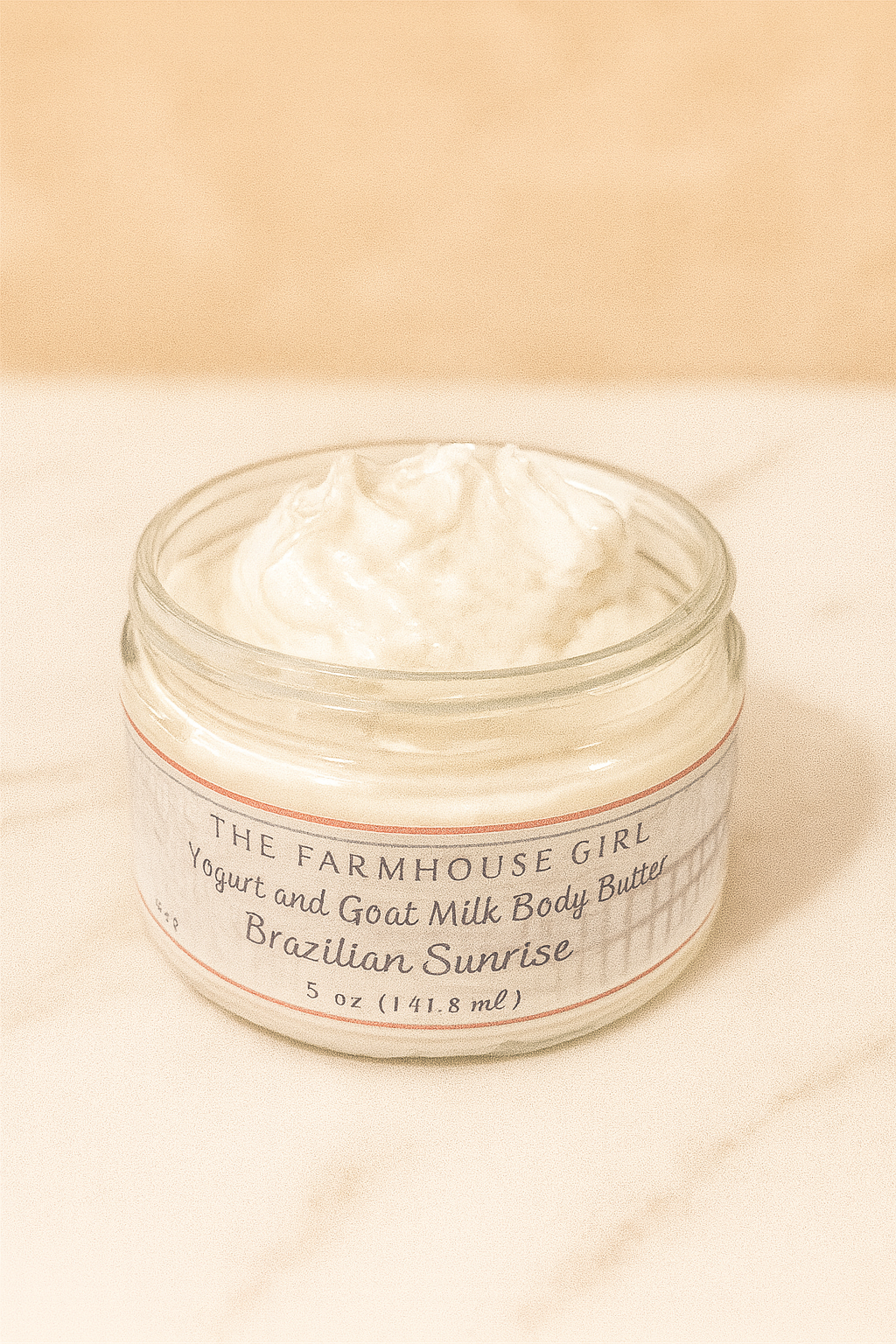 Jar of The Farmhouse Girl yogurt and goat milk body butter on a beige background