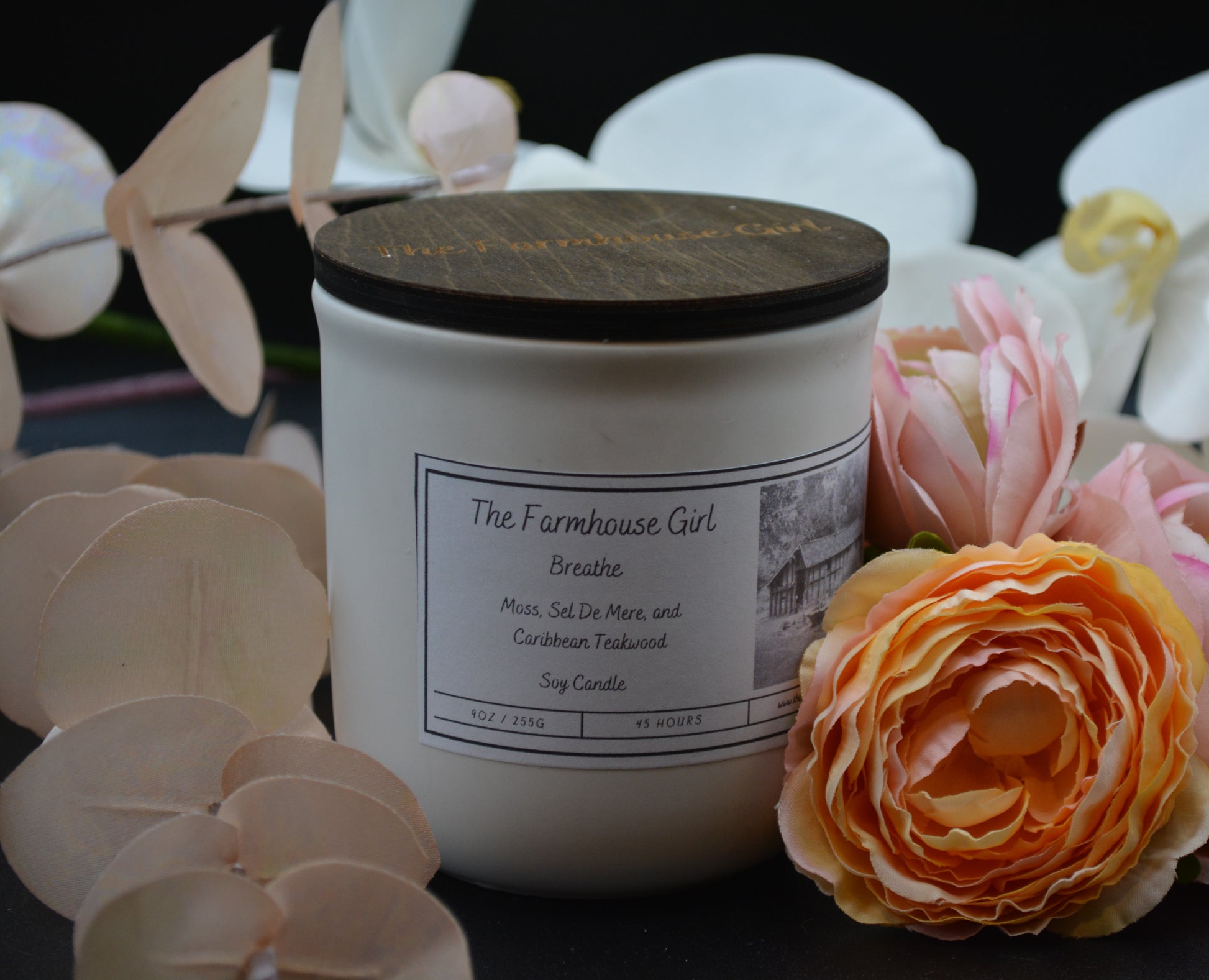 11oz candle named Breathe in a white ceramic jar with walnut lid