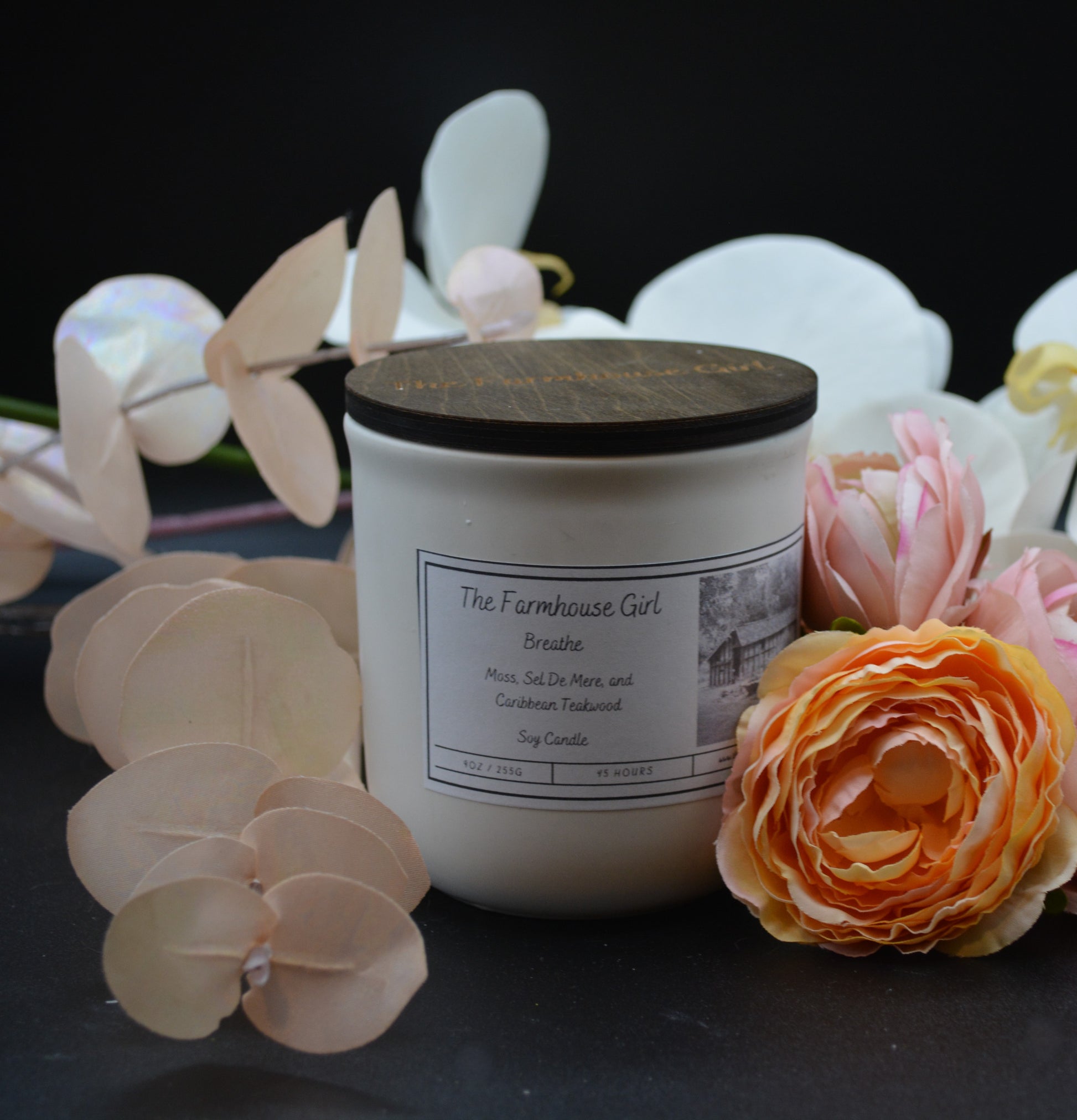 11oz candle named Breathe in a white ceramic jar with walnut lid