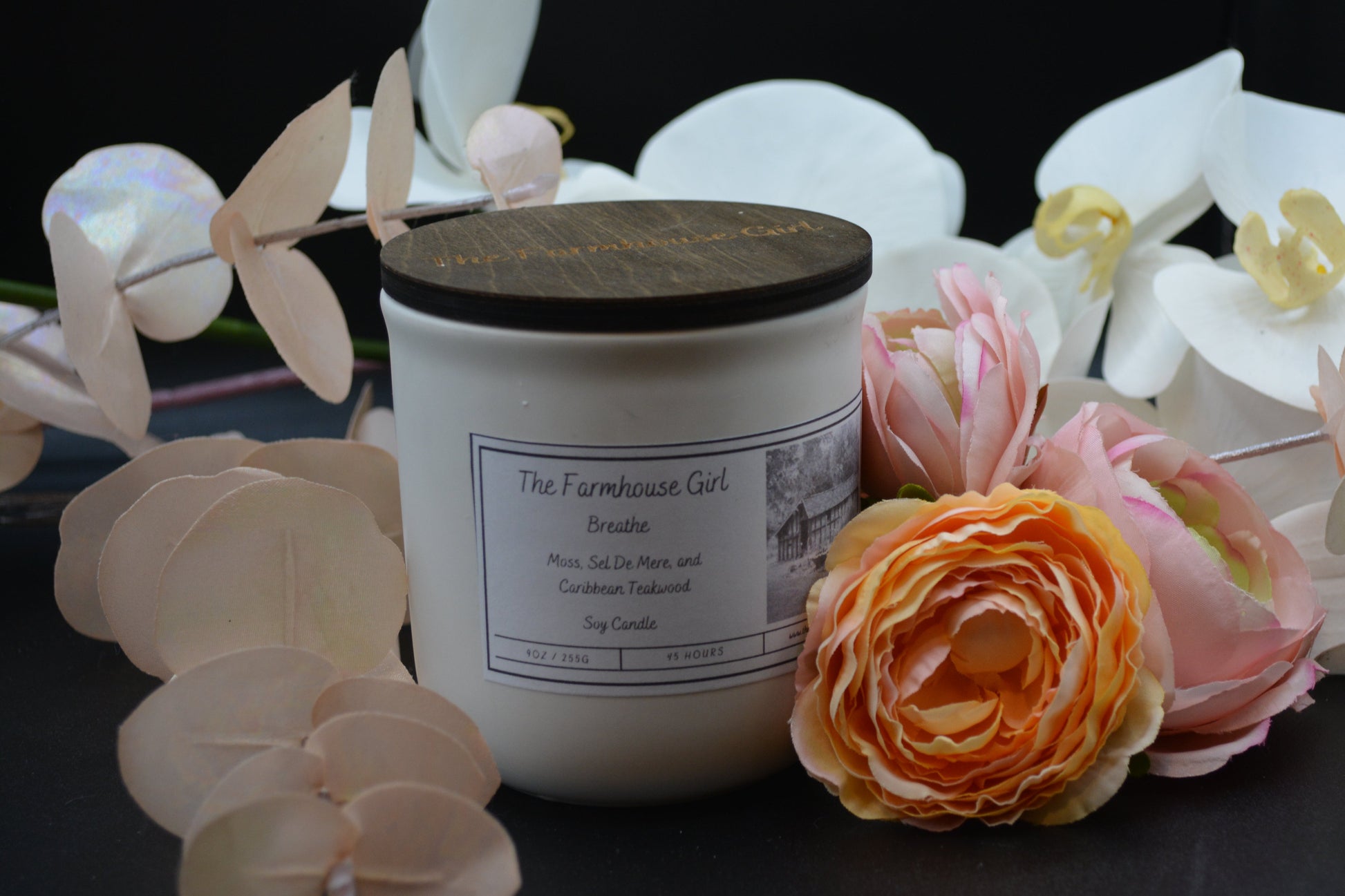 11oz candle named Breathe in a white ceramic jar with walnut lid