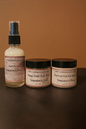 Three products from 'The Farmhouse Girl' on a brown background